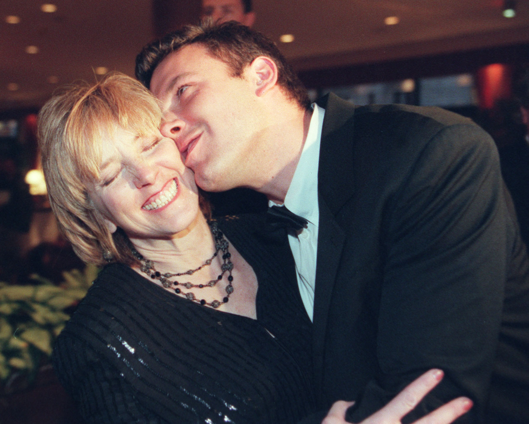 Ben Affleck kisses his mother Chris Affleck in October 2010 | Source: Getty Images